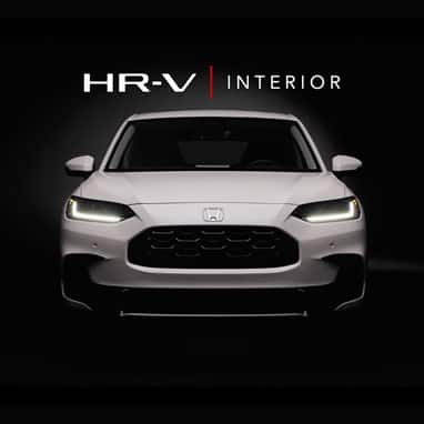 2027 Honda HR-V EX-L in Platinum White Pearl three quarter view in with Interior text (Subcompact Crossover SUV).